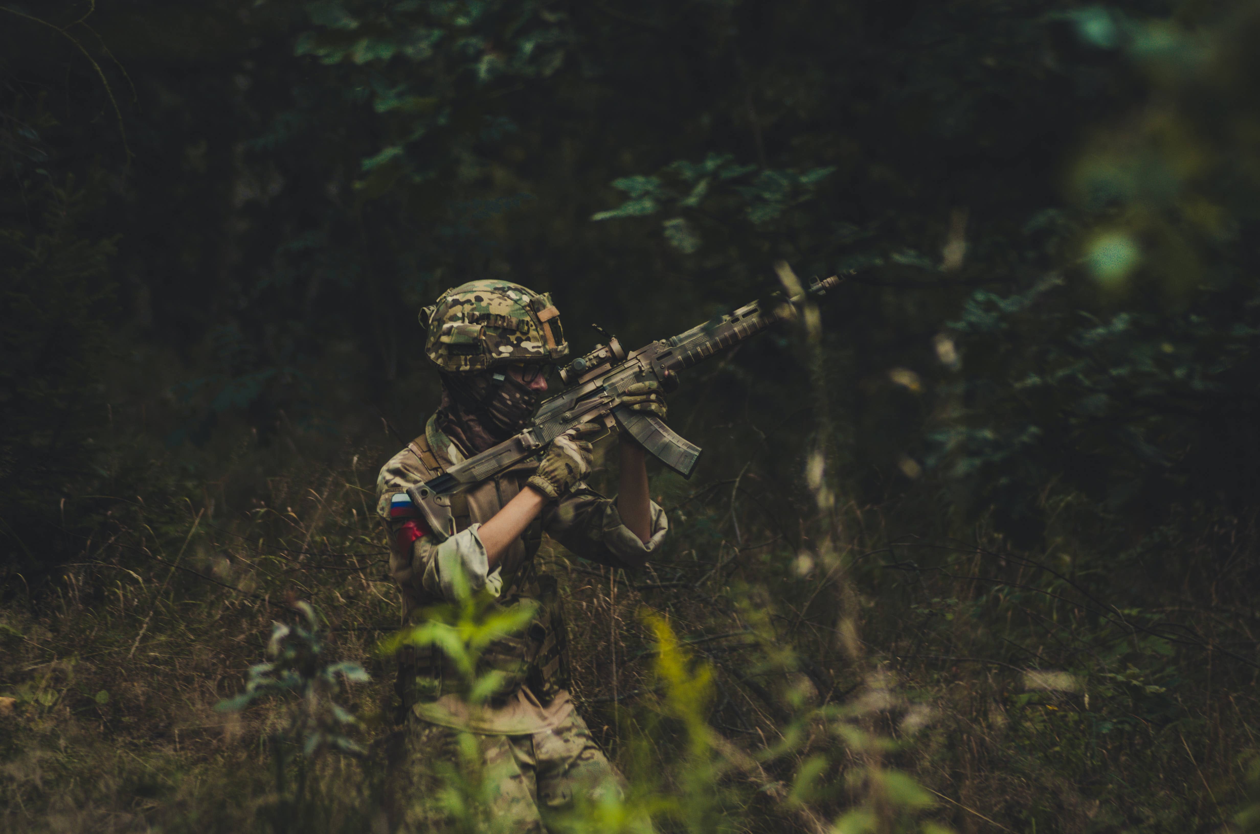 Premium Photo  Portrait of airsoft player in professional equipment with  machine gun in abandoned ruined building soldier with weapons at war in  smoke and fog