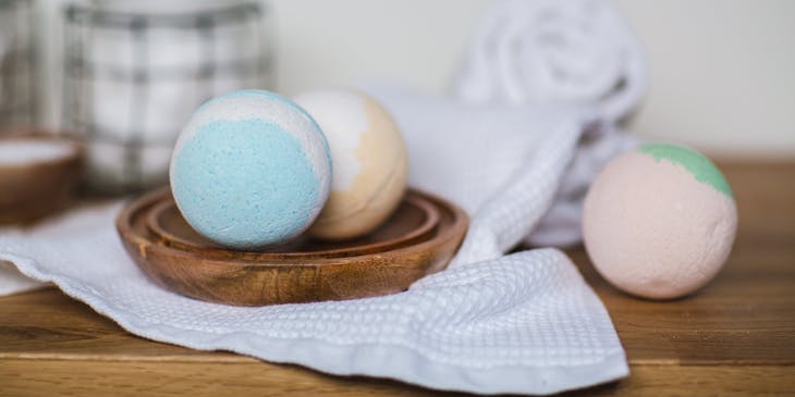 Three bath bombs on a table.