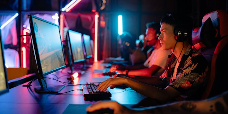 A group of esports gamers playing a match.