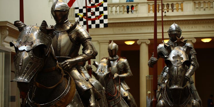 Three honorable knights parading on horseback.