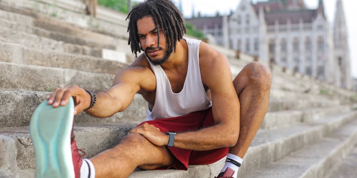 man stretching on steps