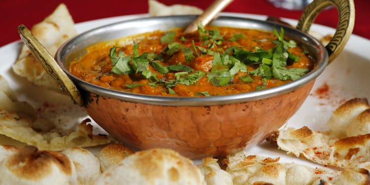 Dish with naan bread at an Indian restaurant.