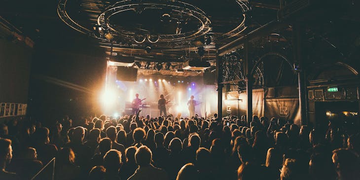 Band playing on stage at a music venue