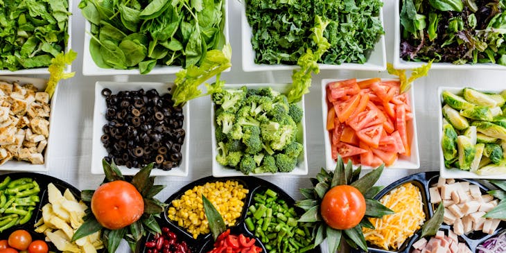 Assorted salad ingredients on display at a salad bar.